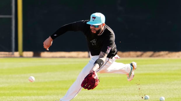 Arizona Diamondbacks' Emmanuel Rivera fields a ground ball during spring training workouts at Salt River Fields at Talking Stick in Scottsdale on Feb. 22, 2024. Mandatory Credit © Rob Schumacher-Arizona Republic / USA TODAY NETWORK